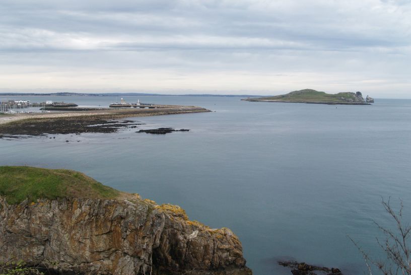 The island of Ireland's Eye and Howth Harbour a half-mile into the Howth cliff walk Howth to Sutton Cliff Walk, Co. Dubin, Ireland