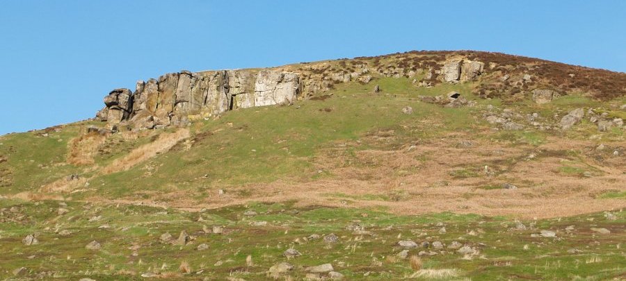 Location 06d: The impressive rock face on Warren Moor above and south of Kildale which is clearly seen from the train.