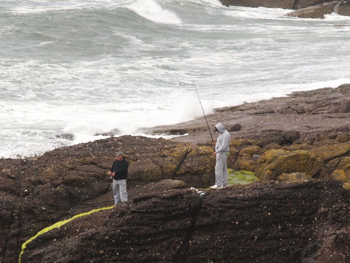 Fishing off the flat rocks is popular at Dunmore East, quite safe for fishermen as long as no big waves!