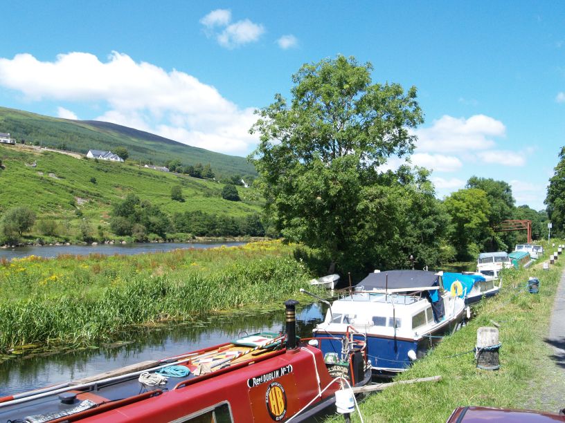 Moored narrow boats and Mount Brandon (Co. Kilkenny) in the distance Walk from Graiguenamanagh to St Mullins, Co. Kilkenny