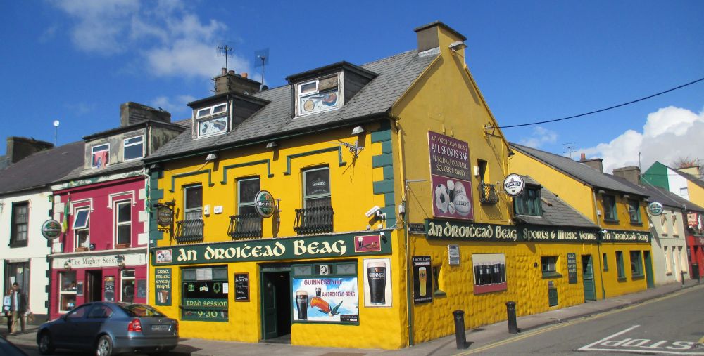 The An Droichead Beag pub in Dingle and on the left is 'The Mighty Session', Dingle, Kerry