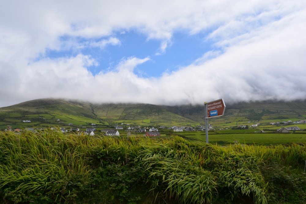 Looking inland towards the hills beyond Dunquin village, Dingle peninsula, Co. Kerry, Ireland