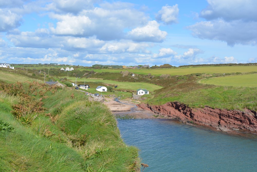 View overlooking Portally beach and inlet from the Dunmore East coastal footpath, which continues on the left to Ballymacaw Co. Waterford