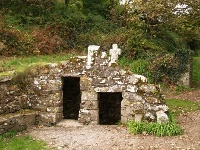 Over the 19th century St Declan's well house are two old (late medieval) very eroded sculptures depicting the crucifixion.Ardmore, Co. Waterford, Ireland