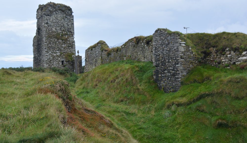 The deep defensive ditch of the castle on the narrow entrance to the Old Head of Kinsale, Co. Cork, Ireland