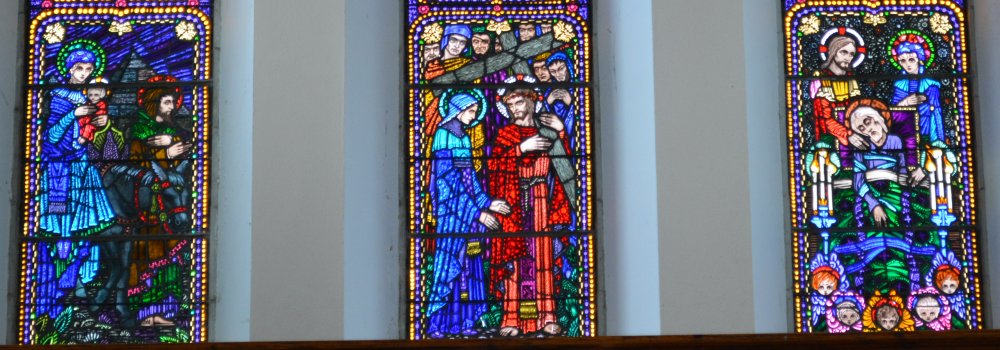 Details of the lower stained glass panels by Harry Clarke in the Church of the Nativity of the Blessed Virgin Mary, Timoleague, Co. Cork, Ireland