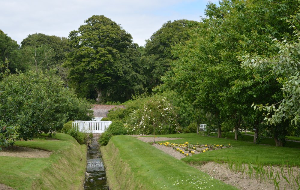 The river runs through the middle of the Colclough Walled Garden and is crossed by five white painted bridges Colclough Walled Garden, Tintern, Co. Wexford 