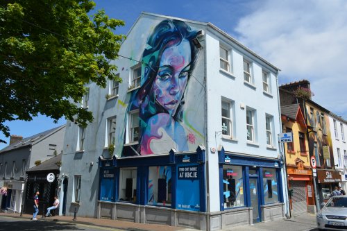 KBC Bank Ireland Hub Waterford - doing different, brightly coloured mural in one corner of James Roberts Square, Waterford city centre.