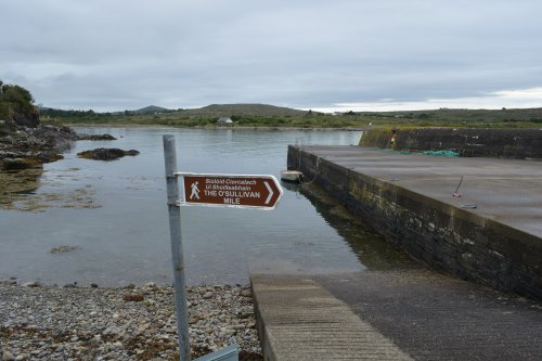 The signpost for the O'Sullivan Mile at a Quay near Trafrask O'Sullivan Mile Walk memorial, Beara Peninsula, Co. Cork