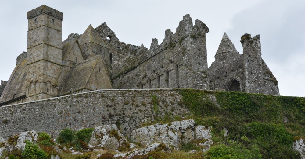 The peak of the round tower can just be seen on the right of the Rock of Cashel, Tipperary, historic Ireland