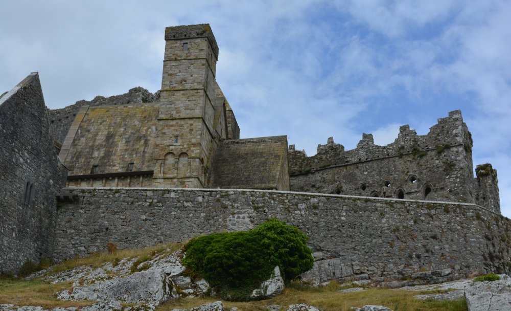 On the left the tower of Cormac's Chapel on the Rock of Cashel, Tipperary, historic Ireland