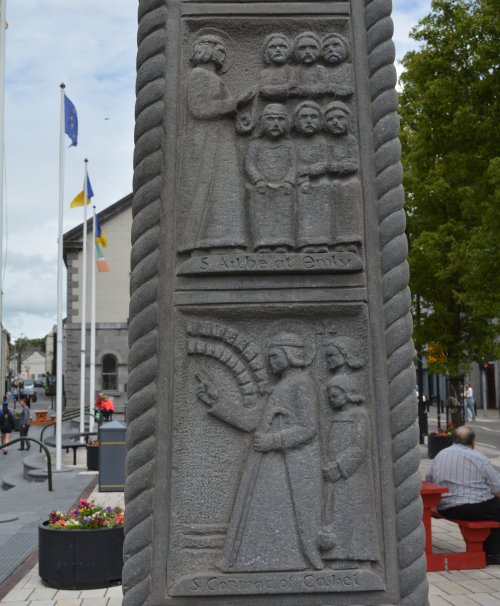 The detail shows St Patrick baptising people converted to Christianity Croke Memorial Cross Cashel, Tipperary, historic Ireland