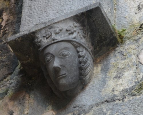 High up on the wall of the ruined medieval Ennis Friary, is an effigy of a King in Ennis Friary. It sits under an arch opposite an effigy of a bishop on the other side of the arch and dated to around 1450-1470 Ennis, Co. Clare, West of Ireland