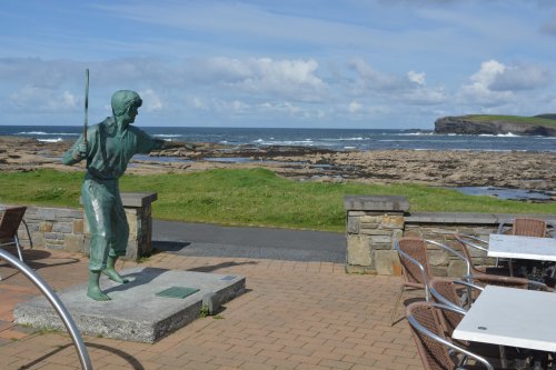 sculpture commemorating Richard 'Dickie' Harris (1930-2002) a noted racquets player and star of stage and screen and a singer and songwriter. Kilkee, Co. Clare, West of Ireland