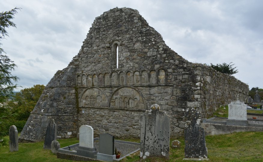 The very impressive Romanesque carvings on the west wall of the ruined Ardmore Cathedral. The panels show many scenes from the Old Testament and maybe some local clergy e.g. bishops or saints associated with the site and area. The carvings are not in their original place but assembled in the west wall during the reconstruction of the cathedral in the 1600s after a century of turmoil and war.  Ardmore, Co. Waterford, Ireland