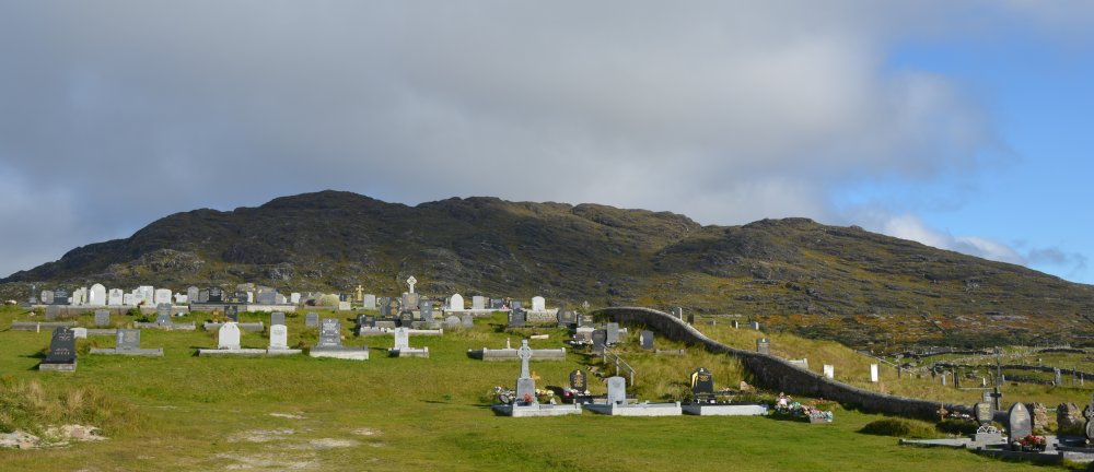 The graveyard and Errisbeg Hill above Dogs Bay Beach, Connemara, Co. Galway, Ireland