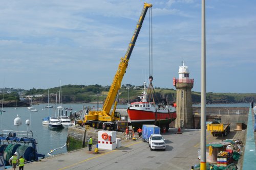 The small fishing boat SO.378 WHITE HEATHER hit rocks, limped back into Dunmore East harbour and then sank.  The boat was lifted out of the harbour, the bow area of the hull repaired and then re-floated Dunmore East harbour summer 2025