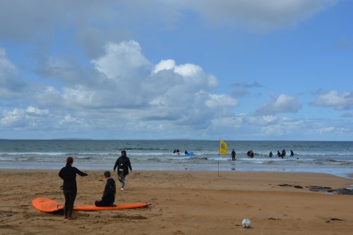 Learning surfing on Fanore Beach. scenic drive R477 road from Doolin to Ballyvaughan via Fanore, The Burren, Murrooghtoohy, Co. Clare, Ireland