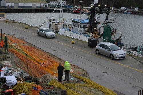 There is always a fishing net being repaired mended on the quayside of Dunmore East Harbour, Co. Waterford, Ireland