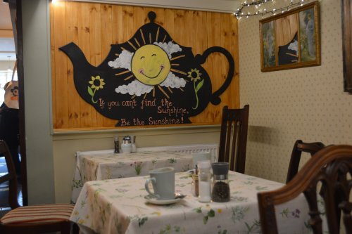The Cracked Teapot cafe in Quay Street opposite the street art murals in Conduit Lane, New Ross, Co. Wexford, Ireland