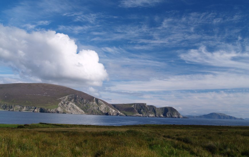 94. The Cliffs of Minaun and Clare Island in Clew Bay viewed from the west of Keel village, Achill Island, Co. Mayo, Ireland.