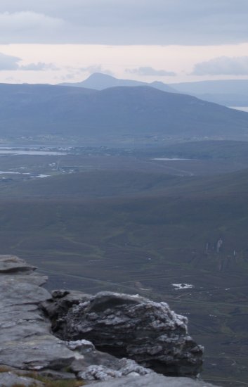 120. A large quartz/quartzite rock (with a leprichorn on it ? aka Molly O'Shea !) and a view across to Croagh Patrick while ascending Slievemore Mountain, Achill Island, Co. Mayo, Ireland. You can also just see the crannog in small lough in the lower right of the right picture!