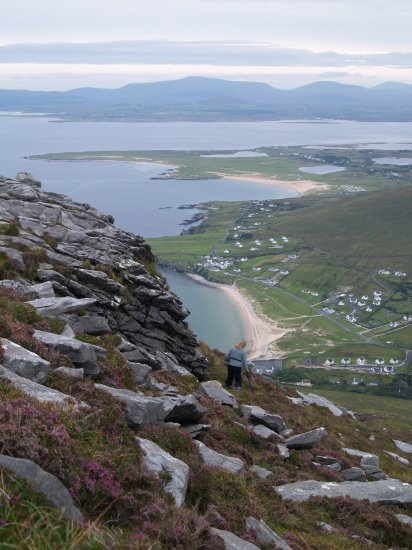 122. Descending the fine ridge of rocks and purple heather on Slievemore Mountain down to Doogort (Dugort) and its two wonderful blue flag beaches, Achill Island, Co. Mayo, Ireland.