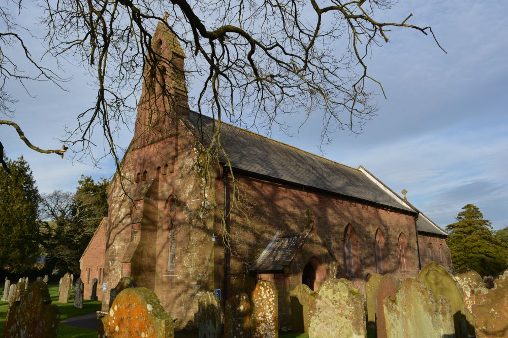 graveyard and exterior architecture St Mary's Church, Gosforth, Cumbria, England
