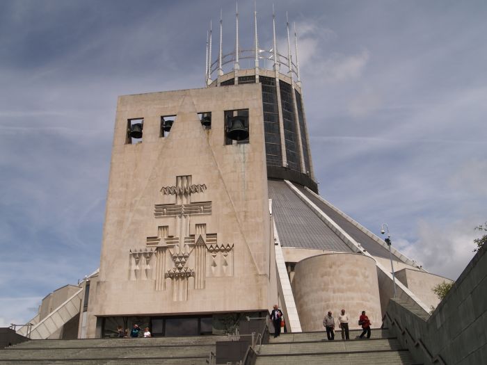 The concrete sculptures and campanile above the entrance to the RC Roman Catholic Cathedral Liverpool