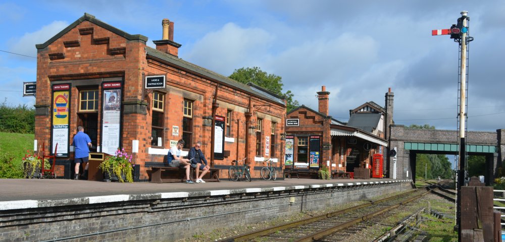 In bright sunshine, a general view of the buildings of Quorn and Woodhouse station, Great Central Railway heritage weekend Gala 'Railways at Work' (GCR August 2023)