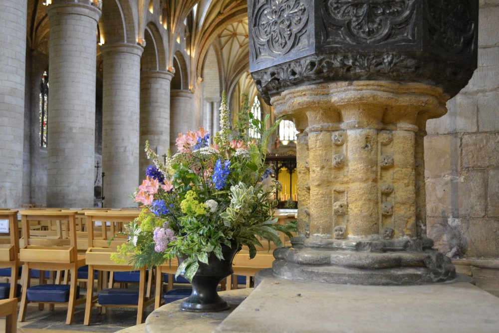 medieval font of Tewkesbury Abbey Gloucestershire England