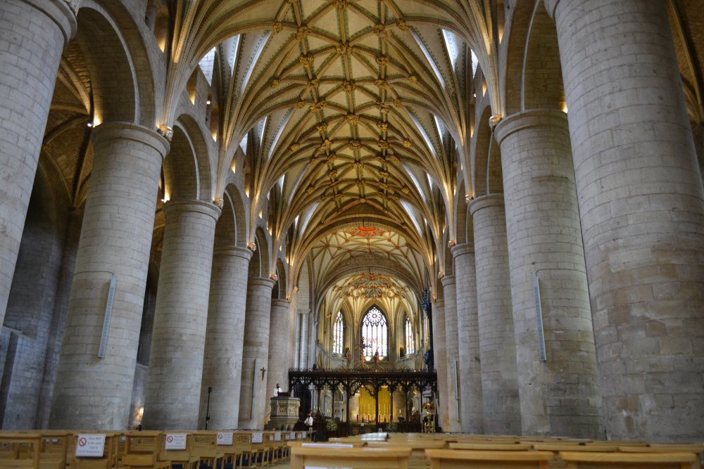 east end of the nave, the rood screen and beyond the choir and altar of Tewkesbury Abbey Gloucestershire England