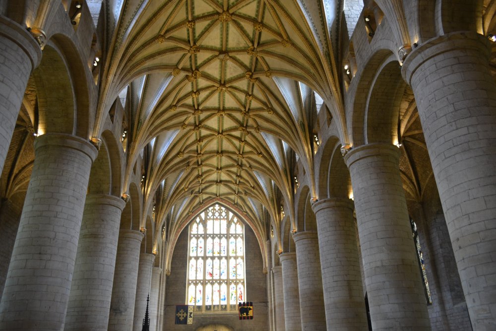 columns and roof vaulting and west window of the west end of the nave of Tewkesbury Abbey Gloucestershire England