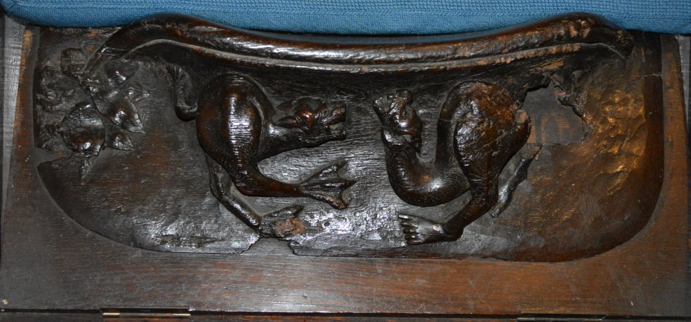 details of carvings of the misericord seating in Tewkesbury Abbey Gloucestershire England