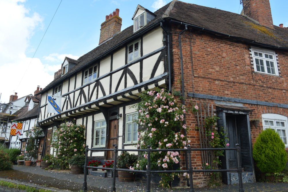 No 1 and 2 Mill Bank house 15th or early 16th century timber-framed houses brick Abbey Mill Cottages by River AvonTewkesbury market town Gloucestershire England