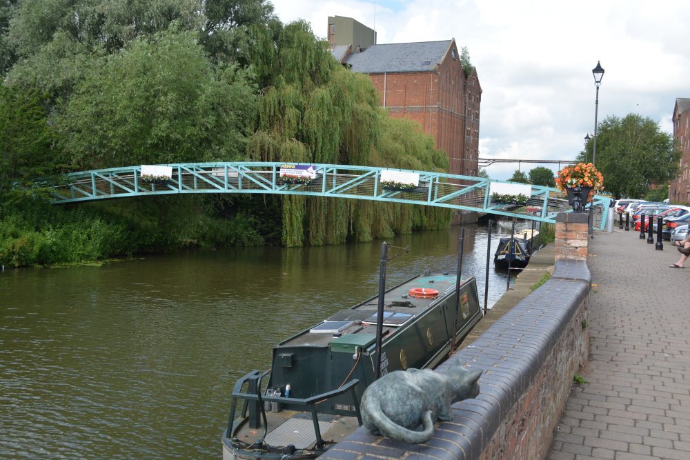 River Avon Mill leat Healings flour mill warehouses Tewkesbury Marina narrow boat trips sculpture of a cat Tewkesbury market town Gloucestershire England