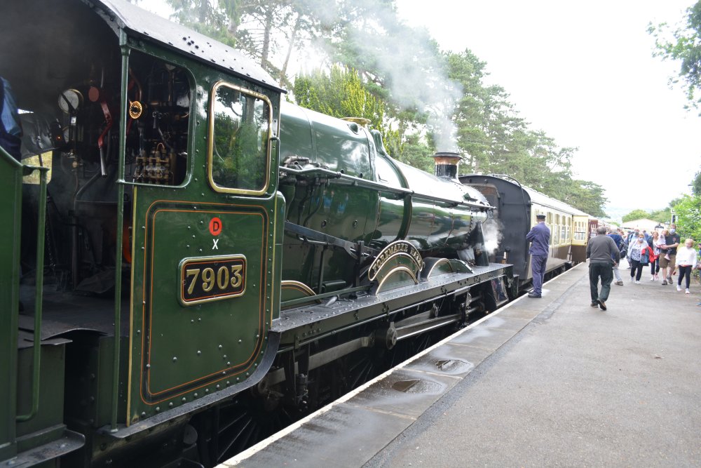 characteristic GWR/BR Western Region cream and brown carriages of a steam train at Cheltenham Race Course station Gloucestershire Warwickshire steam railway England