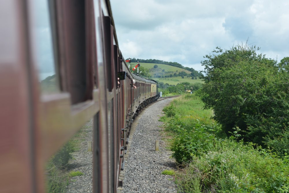 steam hauled train passing through the Bishop's Cleeve and Woodmancote area Gloucestershire Warwickshire steam railway England
