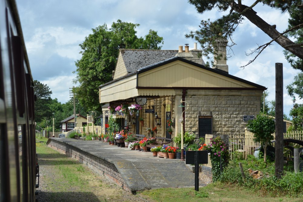 The original Gotherington station, now a private house with a lovely potted plant display Gloucestershire Warwickshire steam railway England