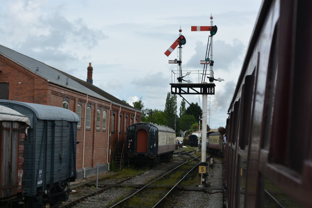 Entering Toddington station, passing a good example of the old GWR semaphore signals Gloucestershire Warwickshire steam railway England