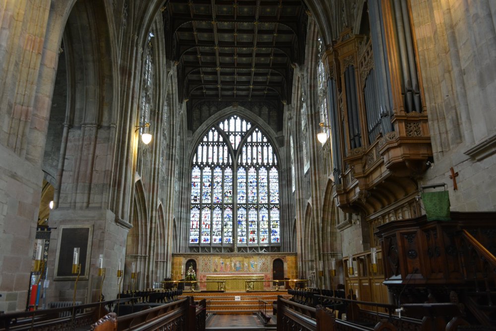 choir stalls and altar in the chancel-sanctuary of Great Malvern Priory Church Worcestershire England