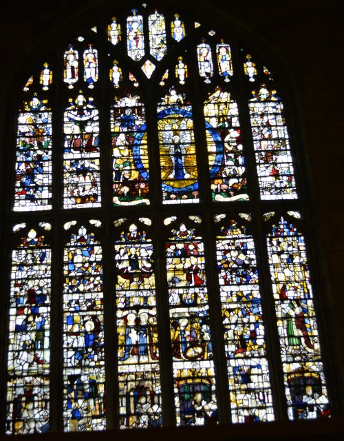 Stained glass window panels in the North Transept, Magnificat Window of Great Malvern Priory Church, given by Henry VII in 1501-1502 Worcestershire England