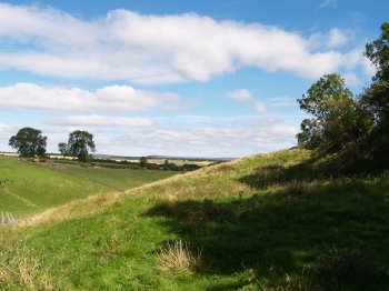 out from the village over to the eastern farmland - Walking from Sutton Bank National Park Visitor Centre, North York Moors National Park, North Yorkshire, Northern England