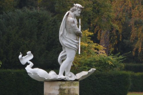 Lead statue of Neptune Studley Royal walks park gardens in Autumn