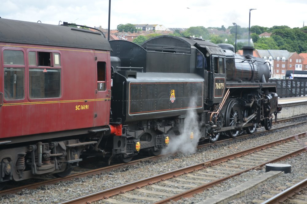 Steam locomotive 76079 ('The Pocket Rocket') departing from Whitby Station with an NYMR steam hauled train to Pickering