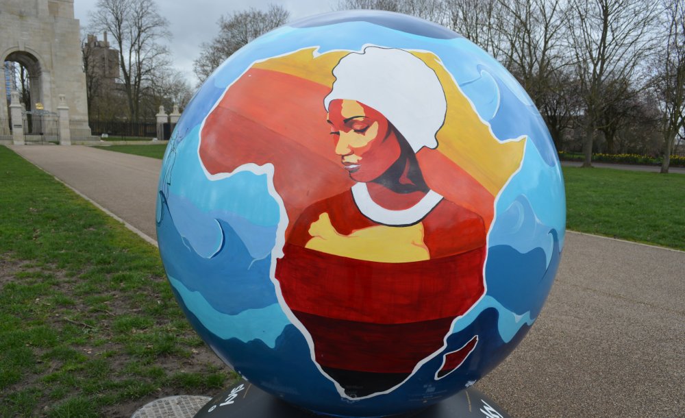 Globe sculpture in Victoria Park Leicester created by Natasha Muluswela  theme Leicester Community Globe'project  she says through this globe sculpture that that racial justice should be rooted in community, in order for it to become a reality.