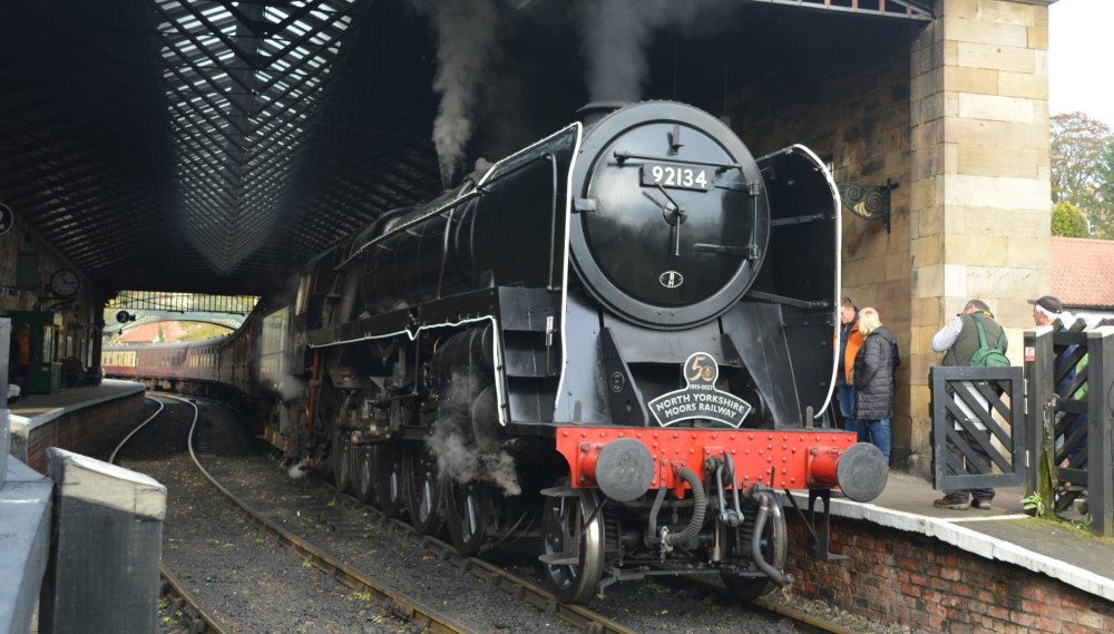
A 9F 2-10-0 freight locomotive just arriving at Pickering Station with an NYMR passenger service from Grosmont. (North Yorkshire Moors Railway, Oct. 2023)
