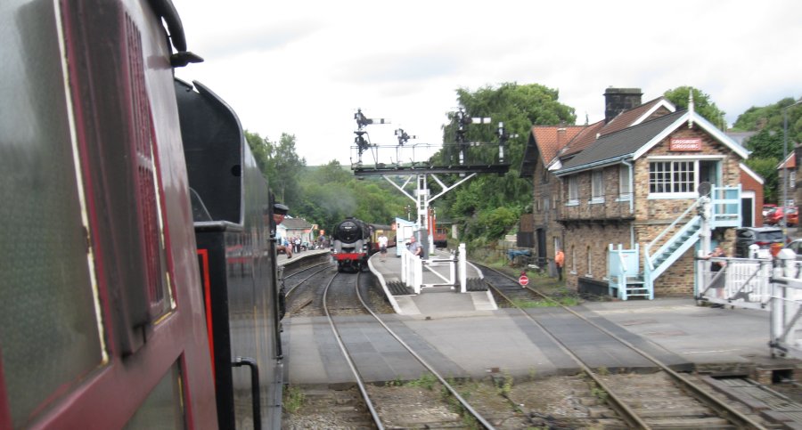 Steam locomotive 45428 ERIC TREACY heading north entering Grosmont station with an NYMR train from Pickering (2024)